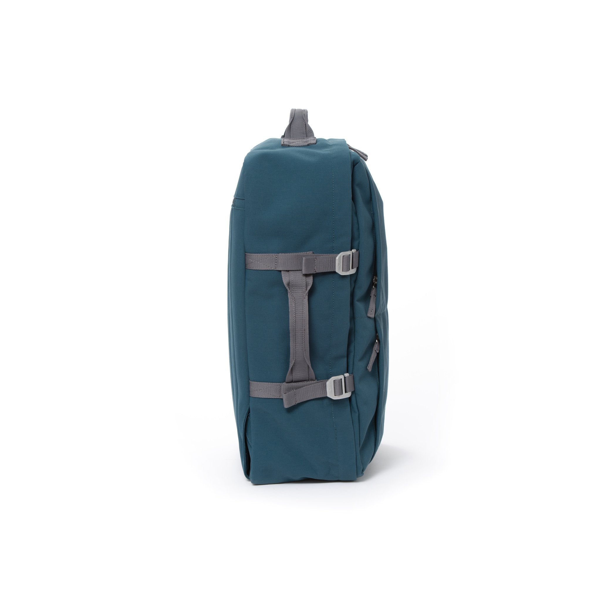 Blue recycled canvas travel backpack with compression side straps.