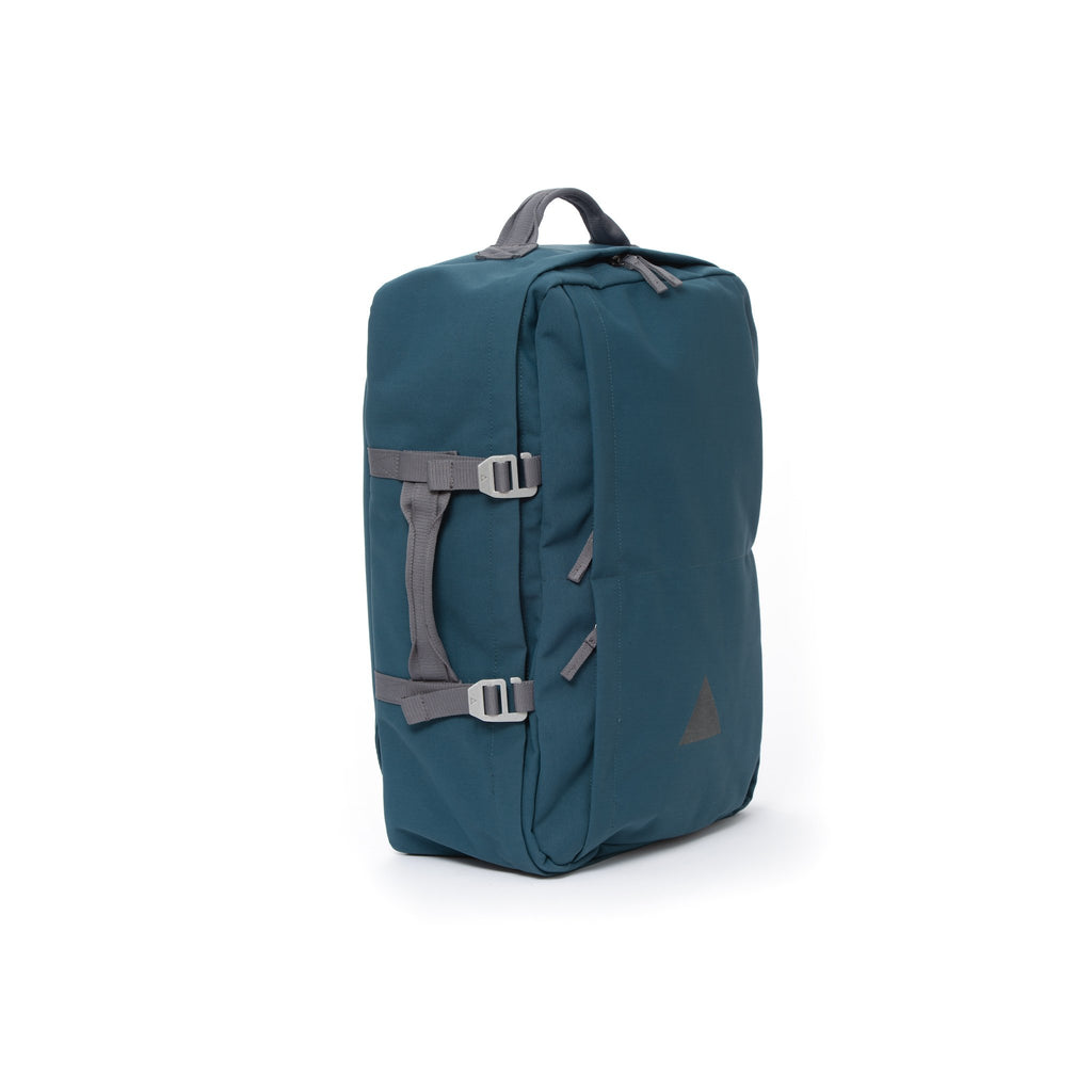Blue recycled canvas travel backpack with carry handle.