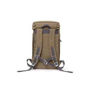 Khaki canvas backpack with padded shoulder straps and chest strap.