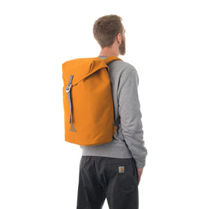 Man carrying orange flap backpack.