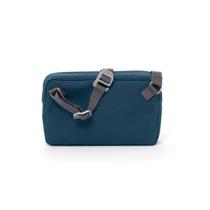 Blue shoulder bag with webbing strap and aluminium buckles.