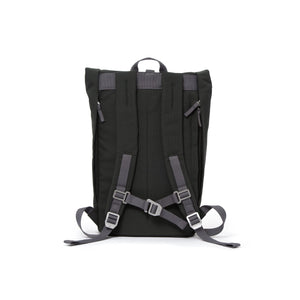 Grey rolltop backpack with padded shoulder straps and chest strap.