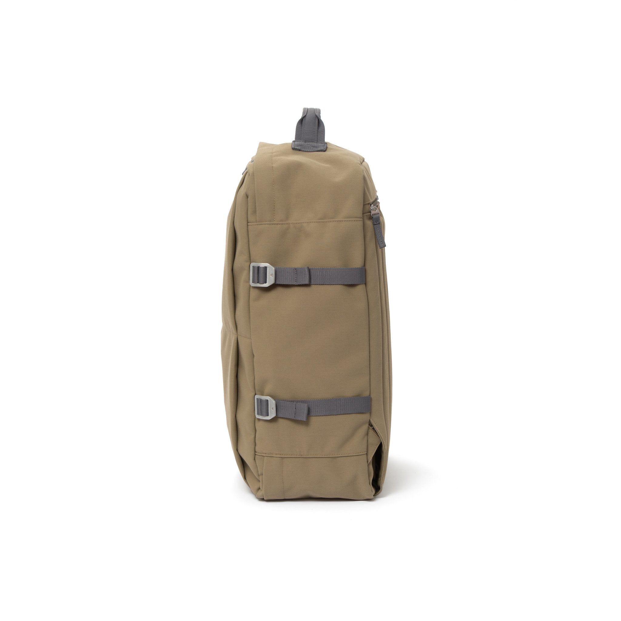 Khaki waterproof canvas travel backpack with compression side straps.