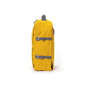 Yellow waterproof canvas travel backpack with compression side straps.