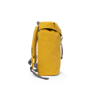 Yellow waterproof backpack with flap and metal buckle.