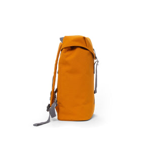 Orange waterproof backpack with flap and metal buckle.